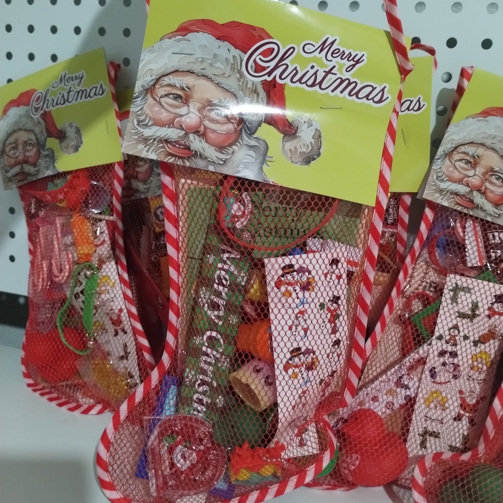 2 Christmas stockings filled with Christmas assortments